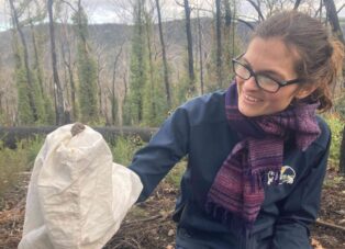 Wildlife Unlimited's Education Manager, Laura Owen, with a house mouse